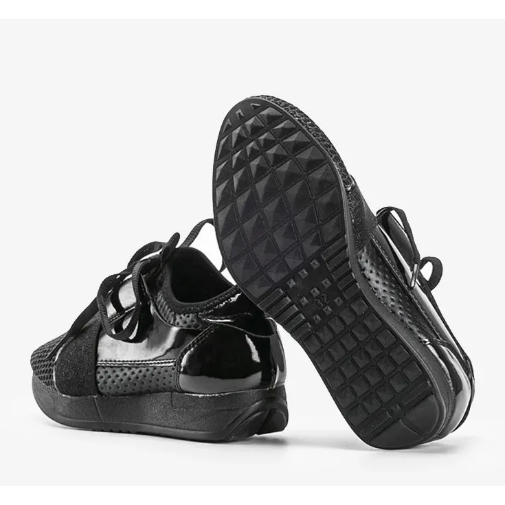 Kelli's black children's sneakers